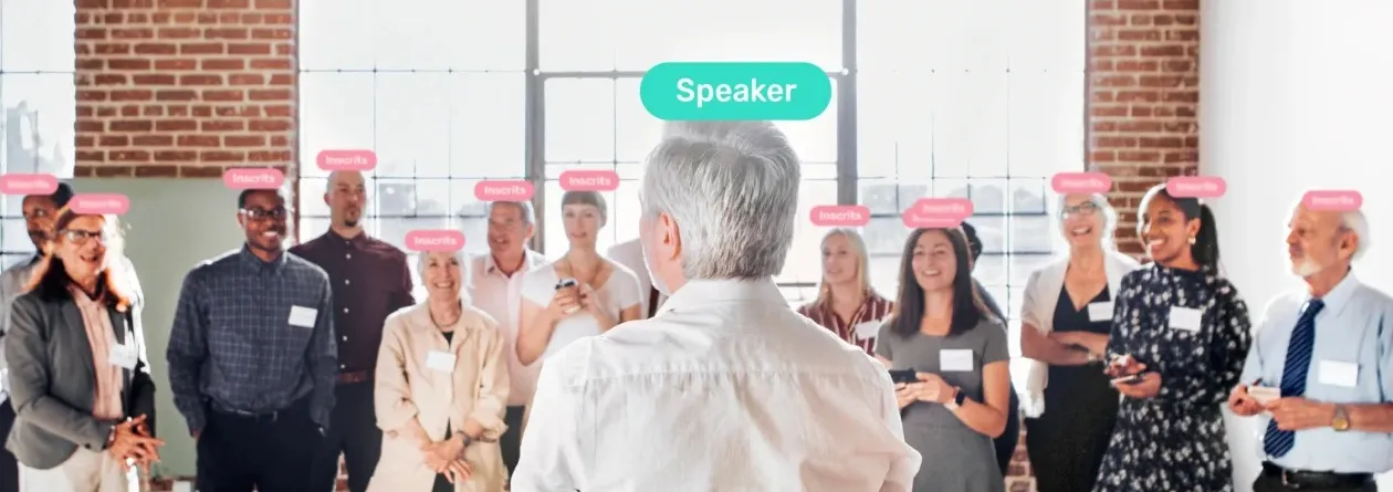 Attendees gathered around a speaker, with their categories